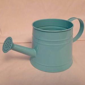 Little blue rustic metal watering can